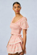 Pink floral short-sleeve smocked mini dress with tiered skirt and square neckline