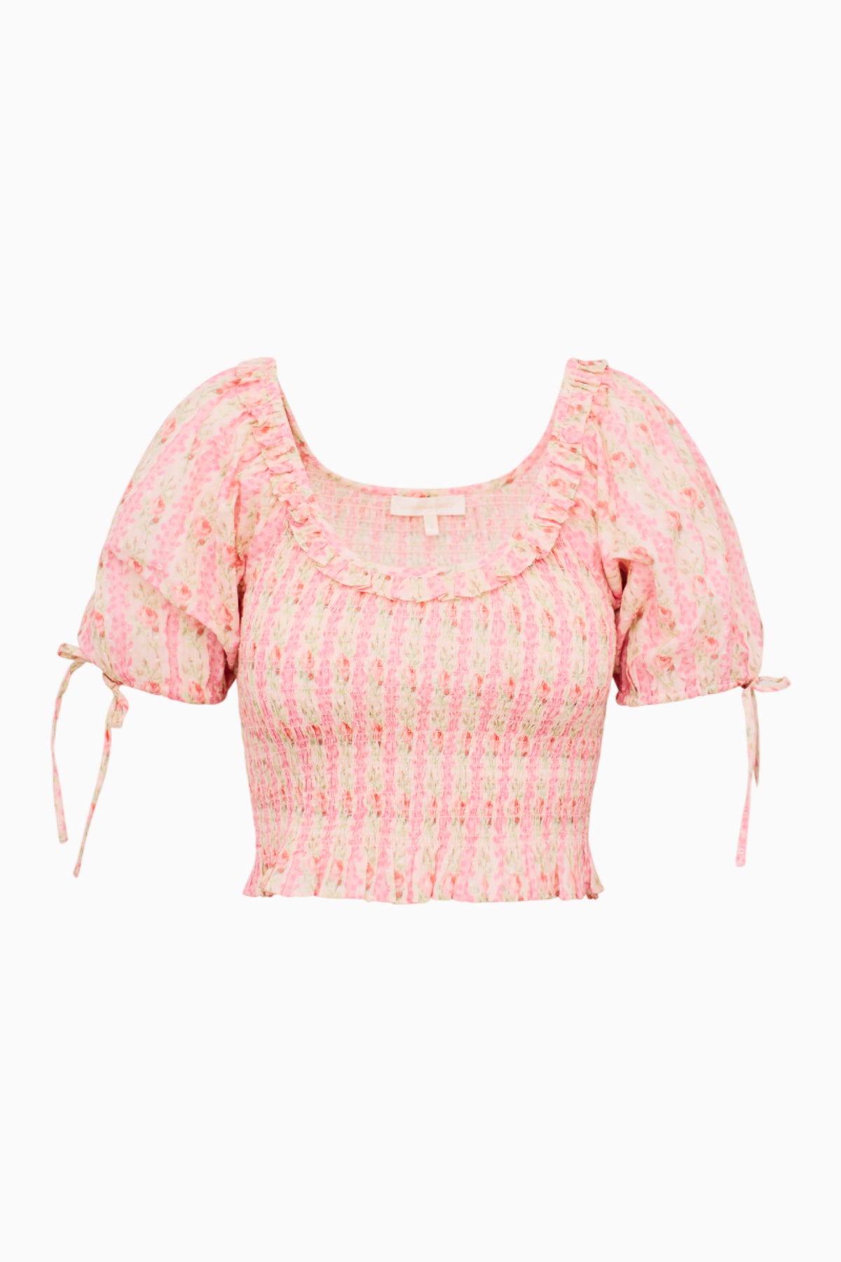 Pink printed peplum top with smocked bodice, puff sleeves, and side tie details