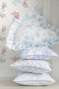 Heart-shaped ruffle pillow in light blue with delicate floral print