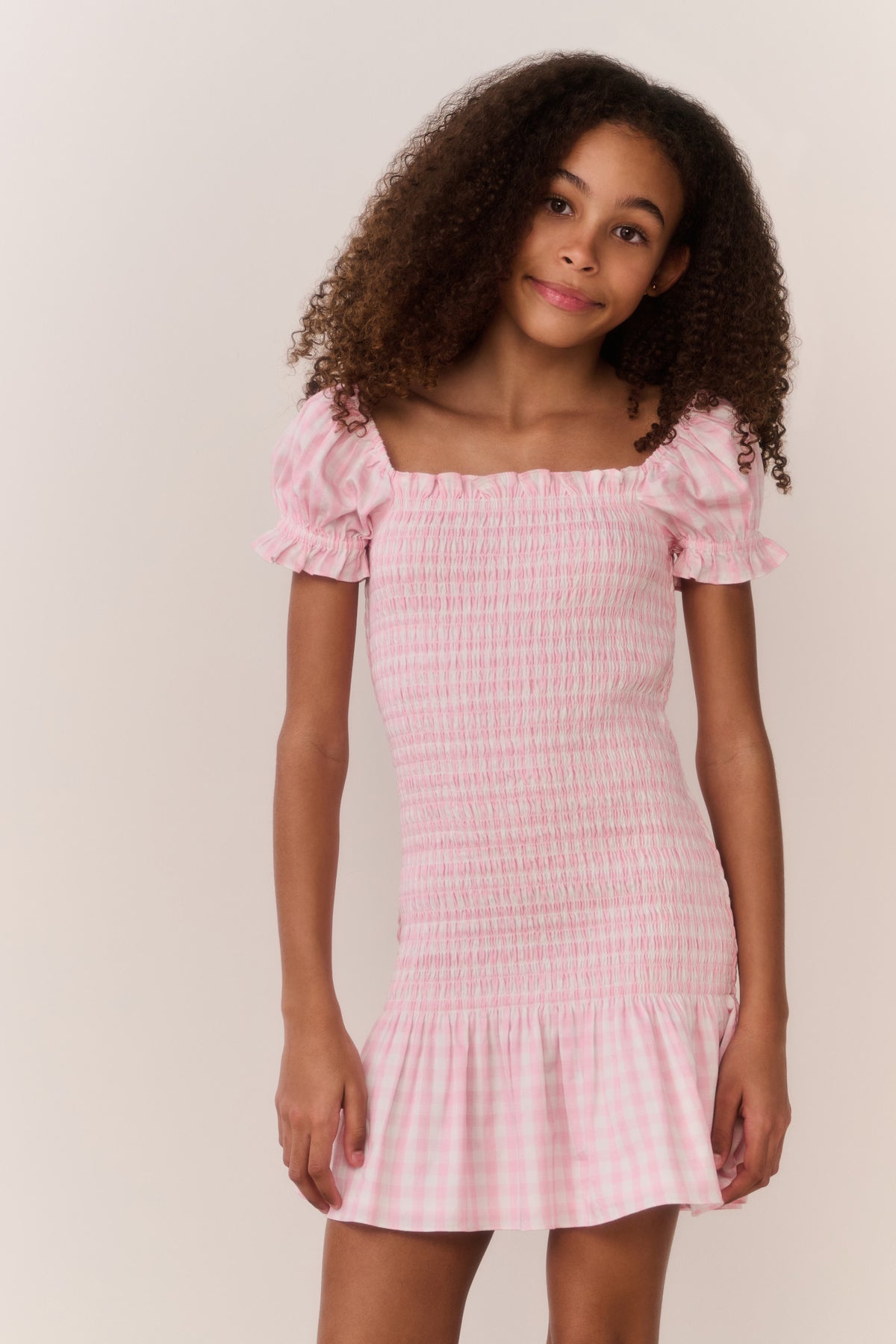 Pink gingham cotton tween dress, square neckline, short puff sleeves, ruffled hem