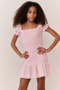 Pink gingham cotton tween dress with square neckline, puff sleeves, and gathered skirt hem