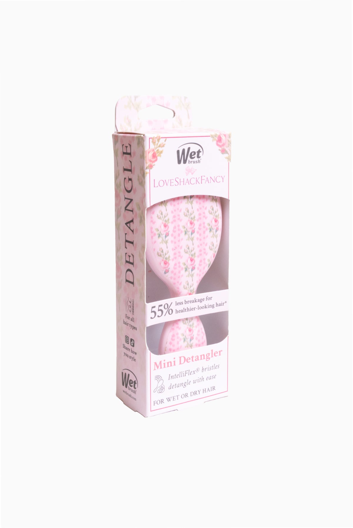 Pink floral mini hair detangling brush with Wet branding, oval brush head