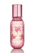 Mini hair and body mist bottle, front label close-up, rose-gold cap