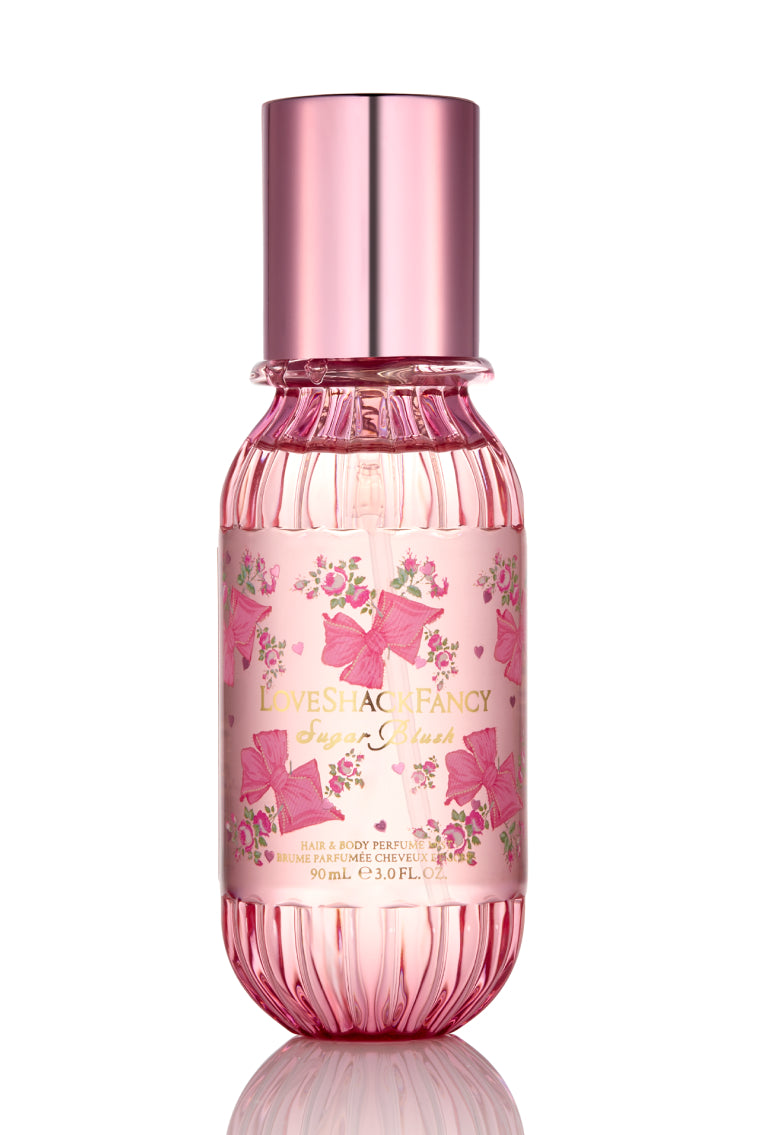 Mini hair and body mist bottle, front label close-up, rose-gold cap