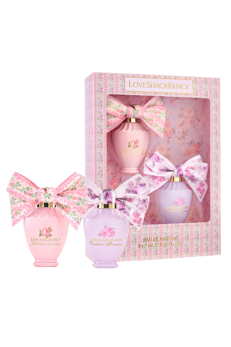 LoveShackFancy mini eau de parfum set with three bottles and ribbon bows, floral pink