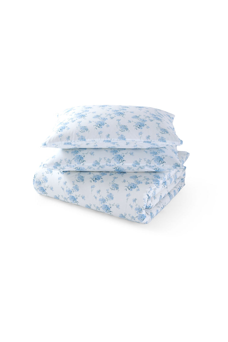 Light blue floral duvet cover and shams set, folded and layered