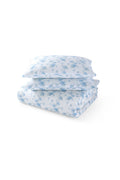 Light blue floral duvet cover and shams set, folded and layered