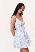 Blue floral linen mini dress with V-neck, thin straps, and flared skater skirt