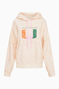 Light peach pullover hoodie with ribbed cuffs, hood drawstrings, front graphic