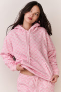 Pink cotton hoodie with hood and drawstring, front view, cropped hands-on waist pose
