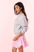 Light lavender pullover sweatshirt with partial NASHVILLE print and long sleeves