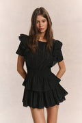 Black mini dress with ruffled short sleeves and tiered skirt