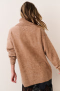 Brown cashmere turtleneck sweater, back view with ribbed cuffs