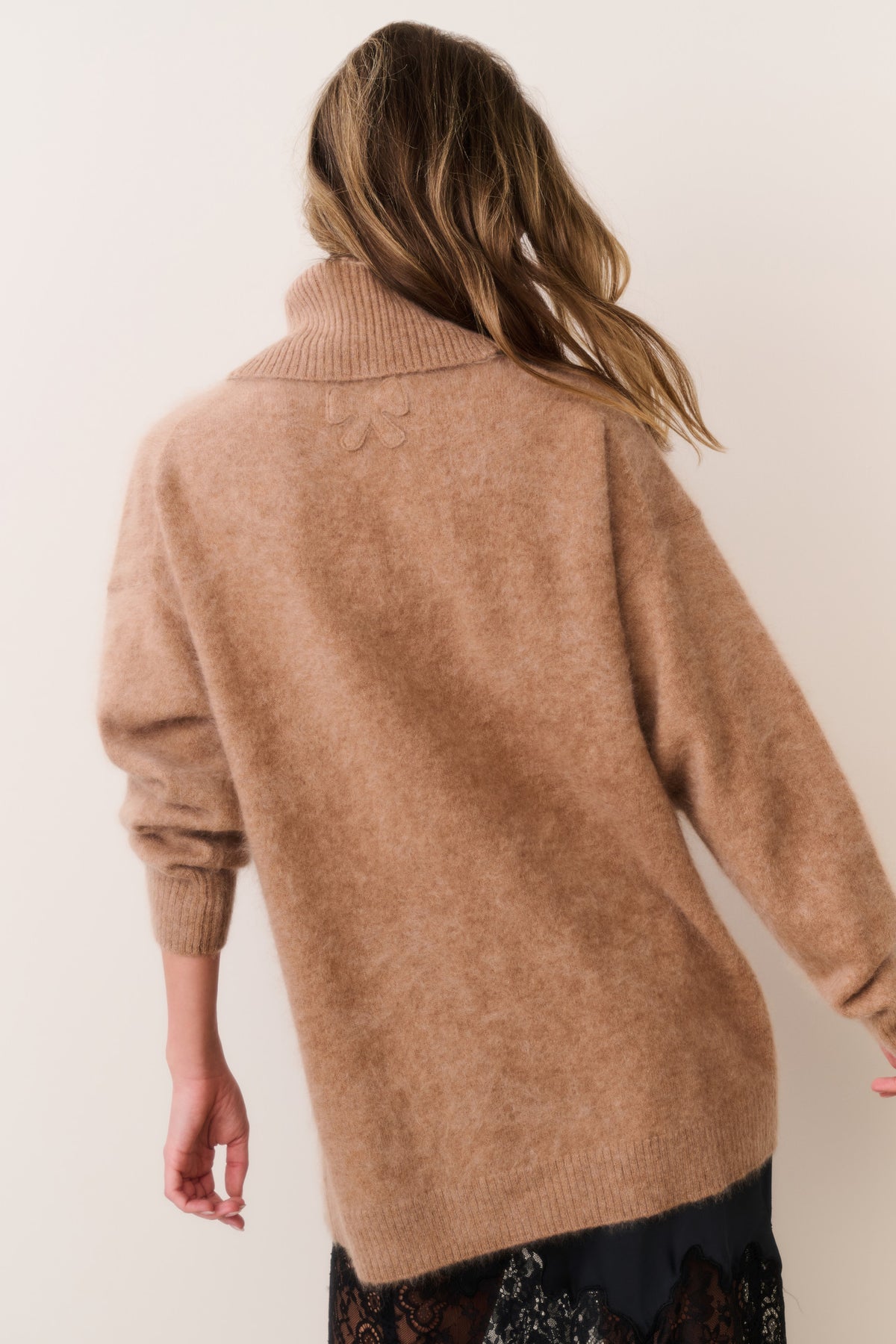 Brown cashmere turtleneck sweater, back view with ribbed cuffs
