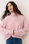 Pink cashmere turtleneck sweater with high ribbed neckline