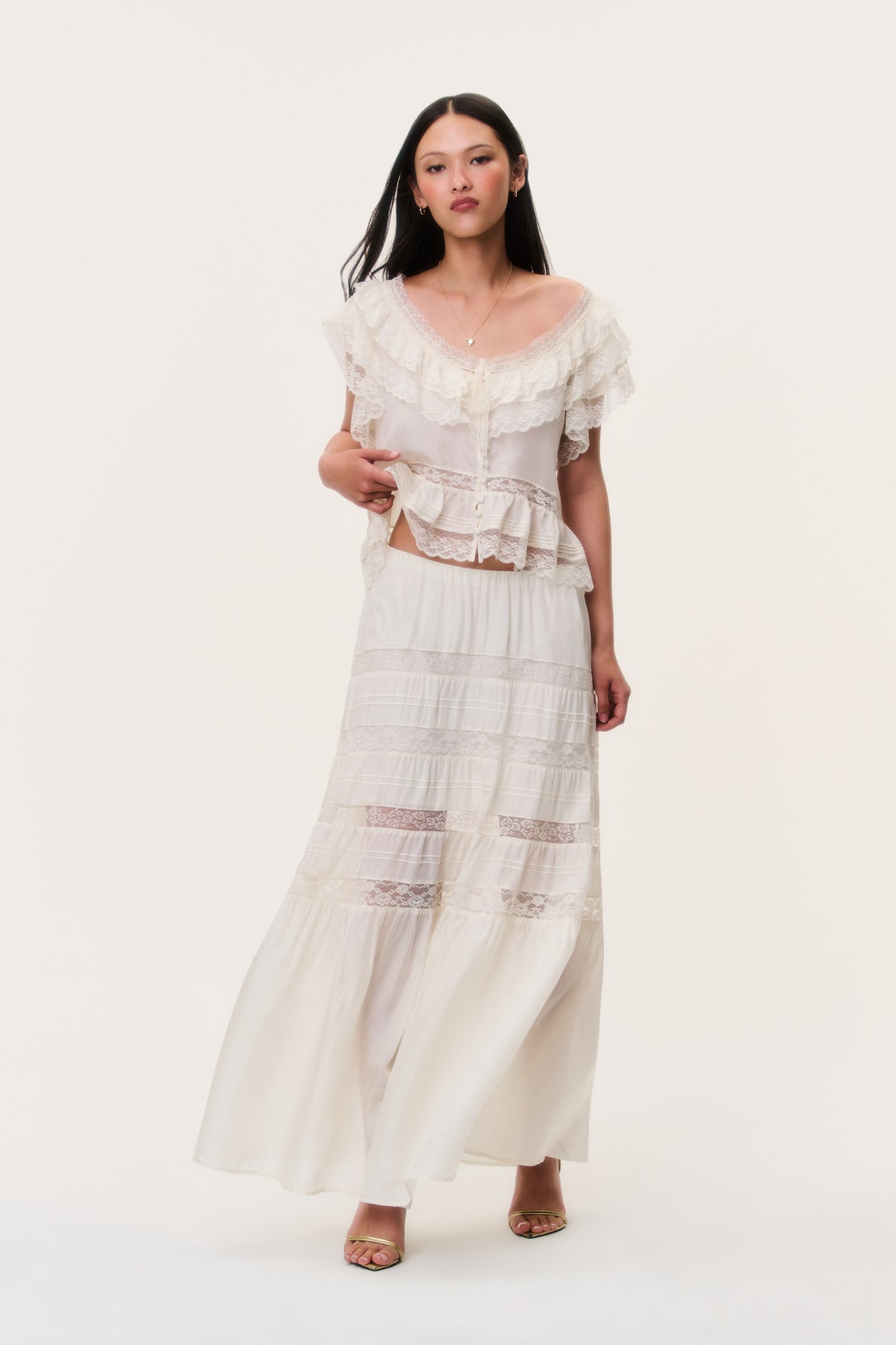 Ivory silk lace maxi skirt with tiered ruffles and sheer panel detailing