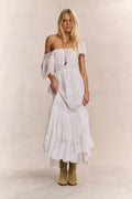 White maxi dress with off-shoulder look, square neckline, lace tiers, and short sleeves