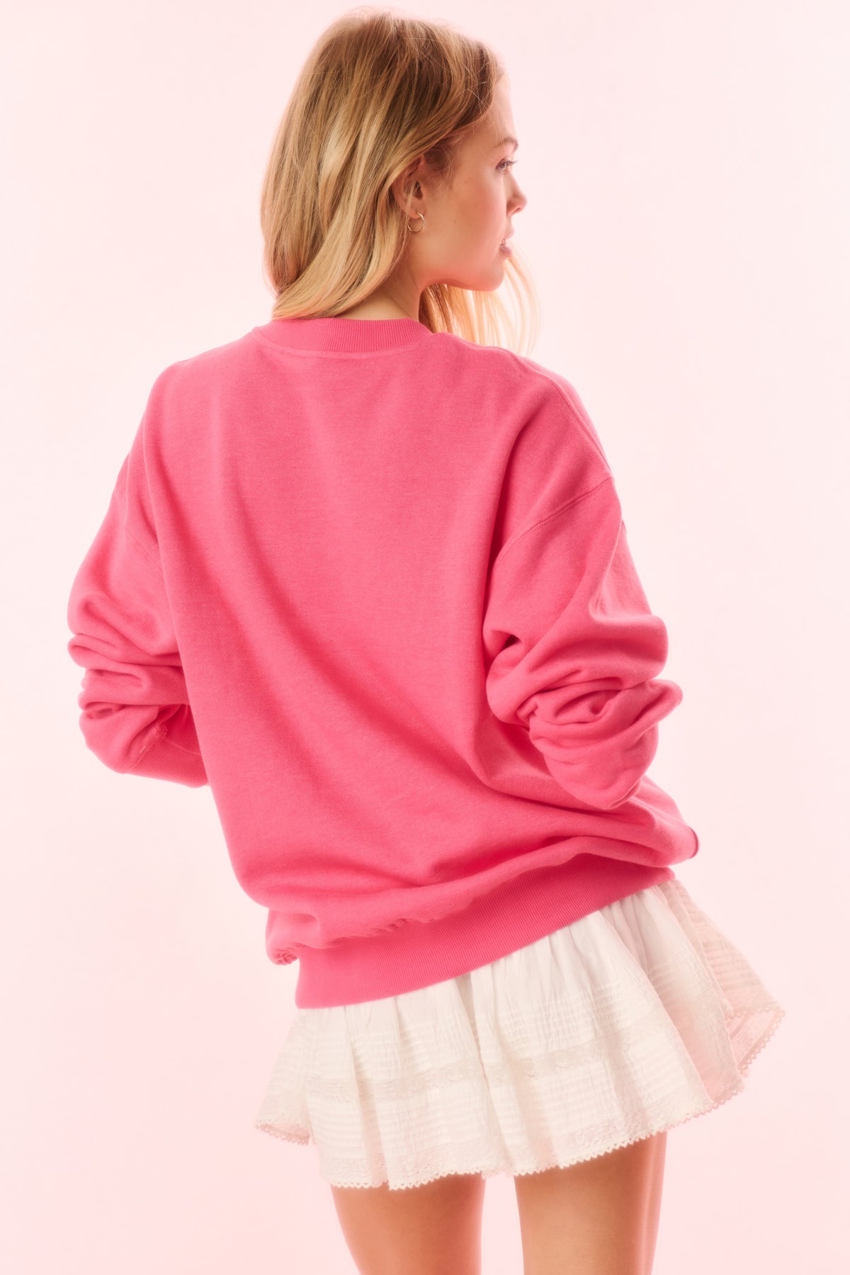 Pink pullover sweatshirt with crew neck and long sleeves (back view)