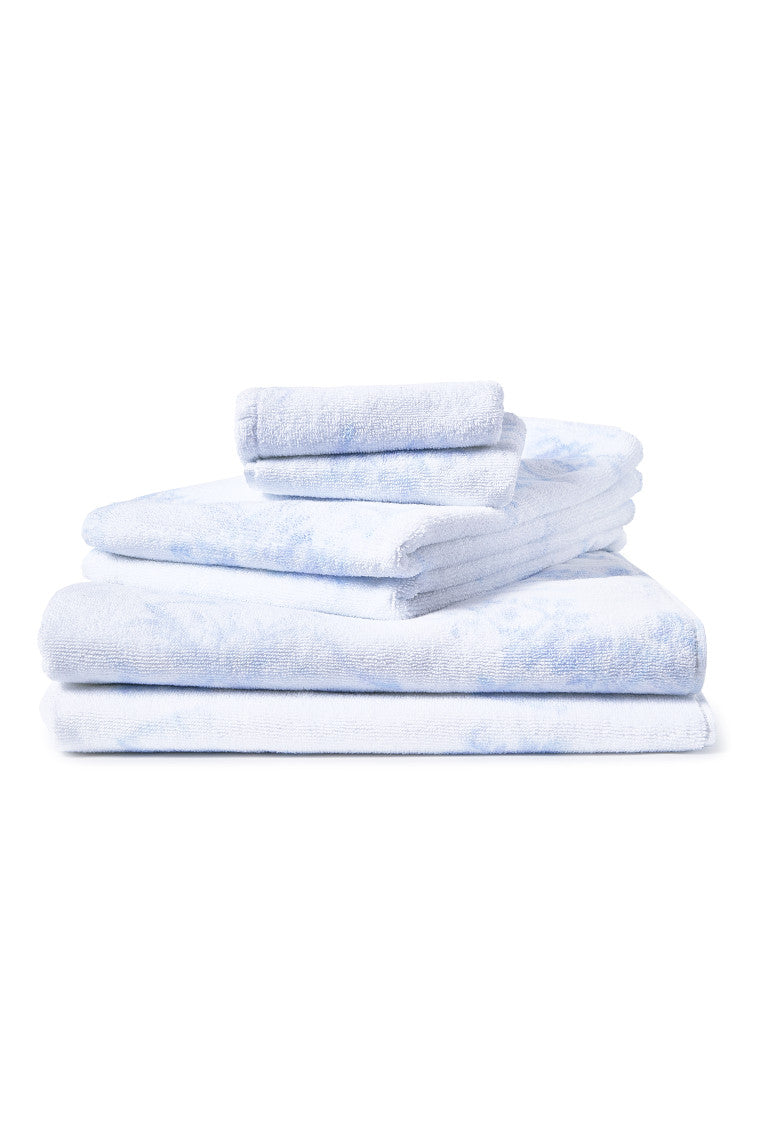 Light blue patterned cotton wash cloth stack, neatly folded