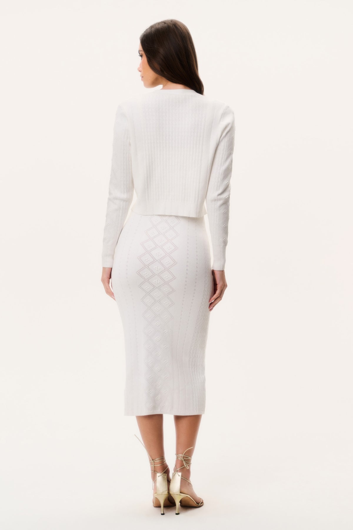 Off-white cotton pointelle cardigan, back view with ribbed hem and long sleeves