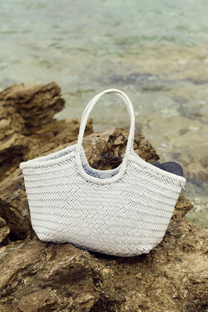 Off-white woven tote bag with oval loop handles, herringbone weave
