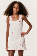 Kids sleeveless cream dress with red cherry prints, scoop neck and ruffle hem