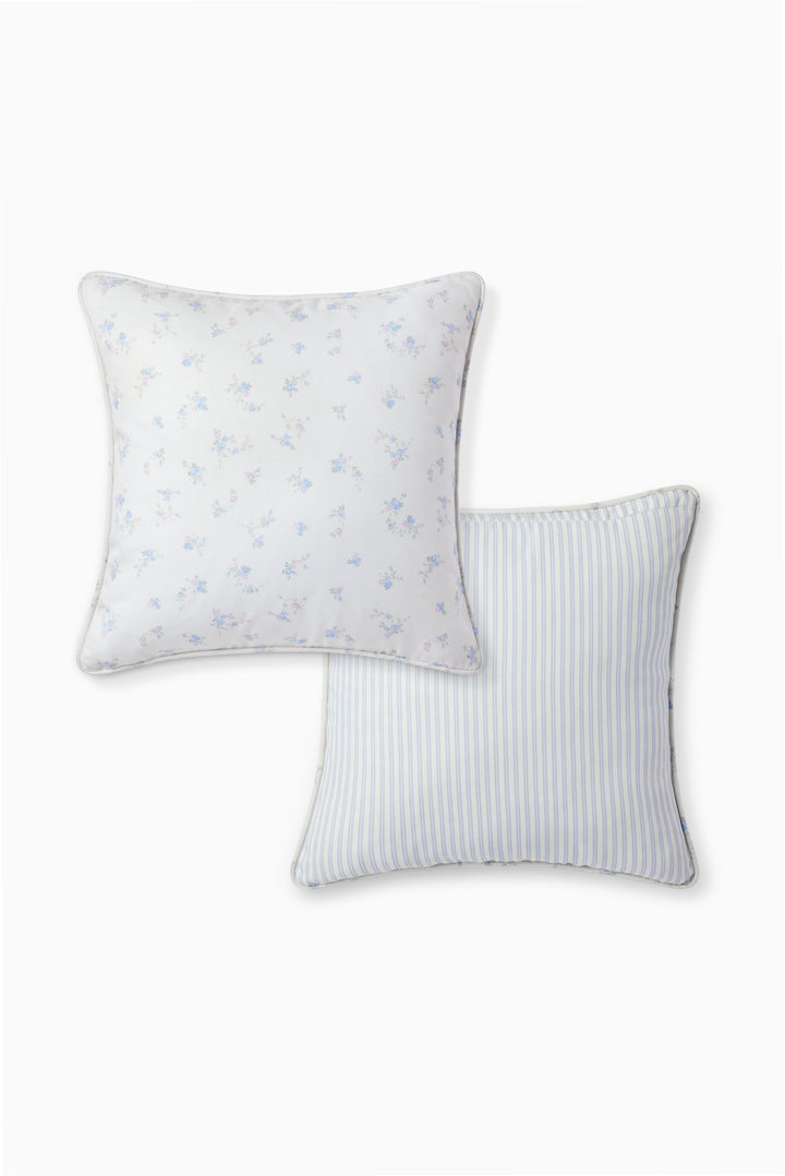 Double-sided outdoor pillow with blue mini motifs and blue-white vertical stripes on reverse