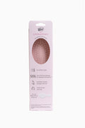 Back of Wet LoveShackFancy detangler brush packaging with 55% claim