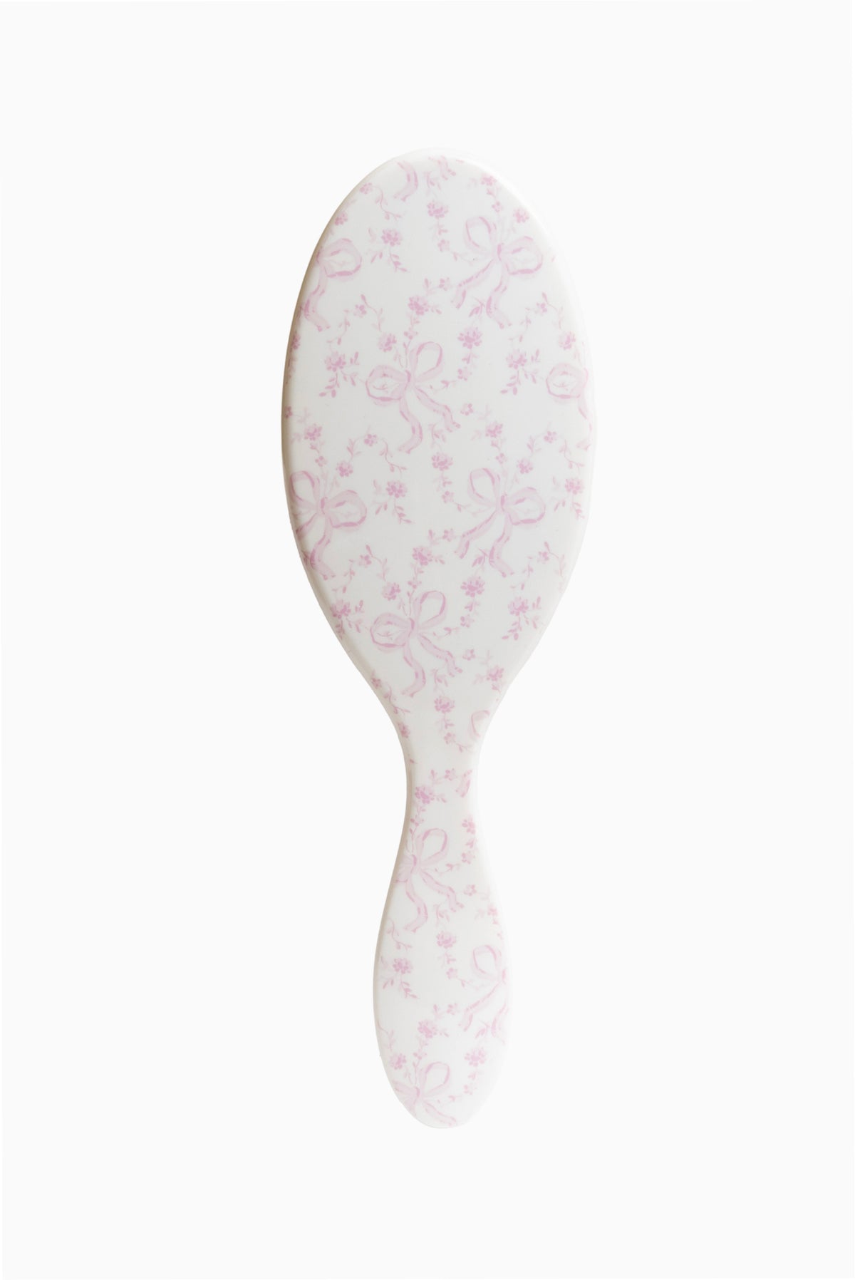 Pink floral detangling hair brush with oval paddle shape and bristle surface