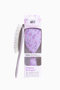 Original detangling hair brush with purple floral handle and bristle pad