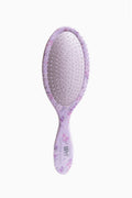 Purple floral paddle hair brush with dotted bristles on cushioned pad
