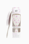 Ribbon Rosa Original Detangler hair brush with pink floral bristle head and white handle