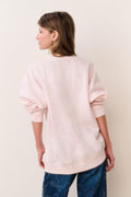 Location pullover sweatshirt in light pink, back view with ribbed cuffs