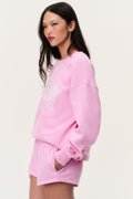 Sunbeam pink fleece shorts with elastic waistband and visible side seam