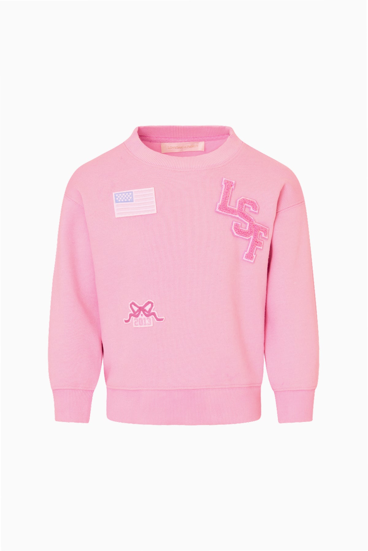 Pink tween varsity pullover sweatshirt with embroidered letters and small patch details