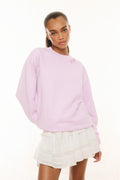 Lavender pullover sweatshirt with small floral chest graphic and ribbed neckline