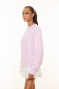 Lavender pullover sweatshirt with long sleeves and small floral chest graphic