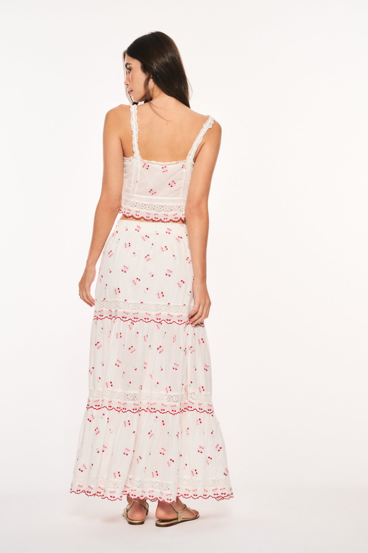 Optic white cotton maxi skirt back view with red cherry print and ruffled tiers