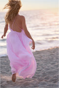 Light pink chiffon maxi dress with open back and thin spaghetti straps