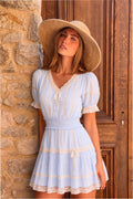 Light blue cotton mini dress with lace trim, puff sleeves, tiered skirt, bow-tie neckline