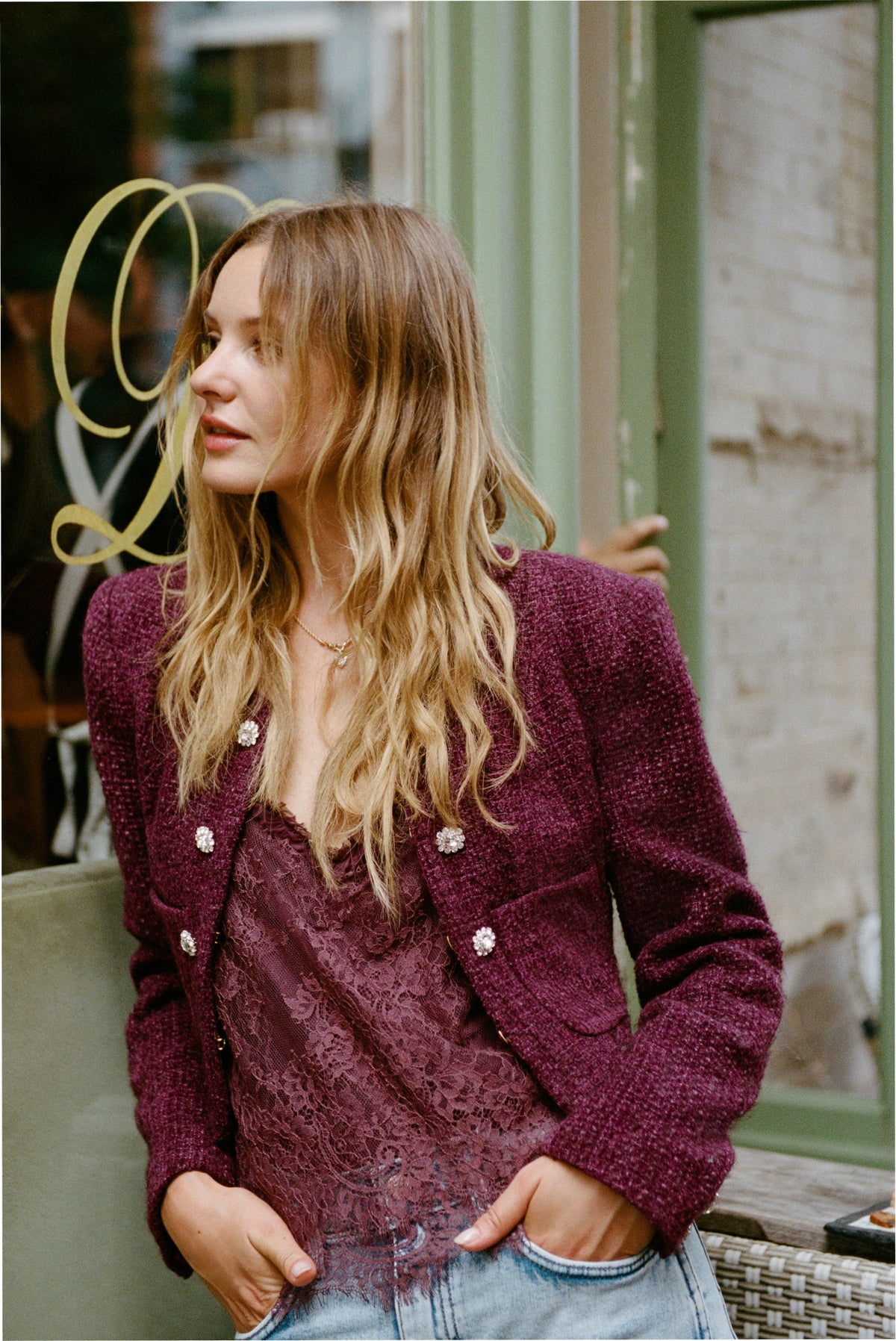 Bordeaux tweed V-neck jacket with long sleeves, open front, and small decorative button details