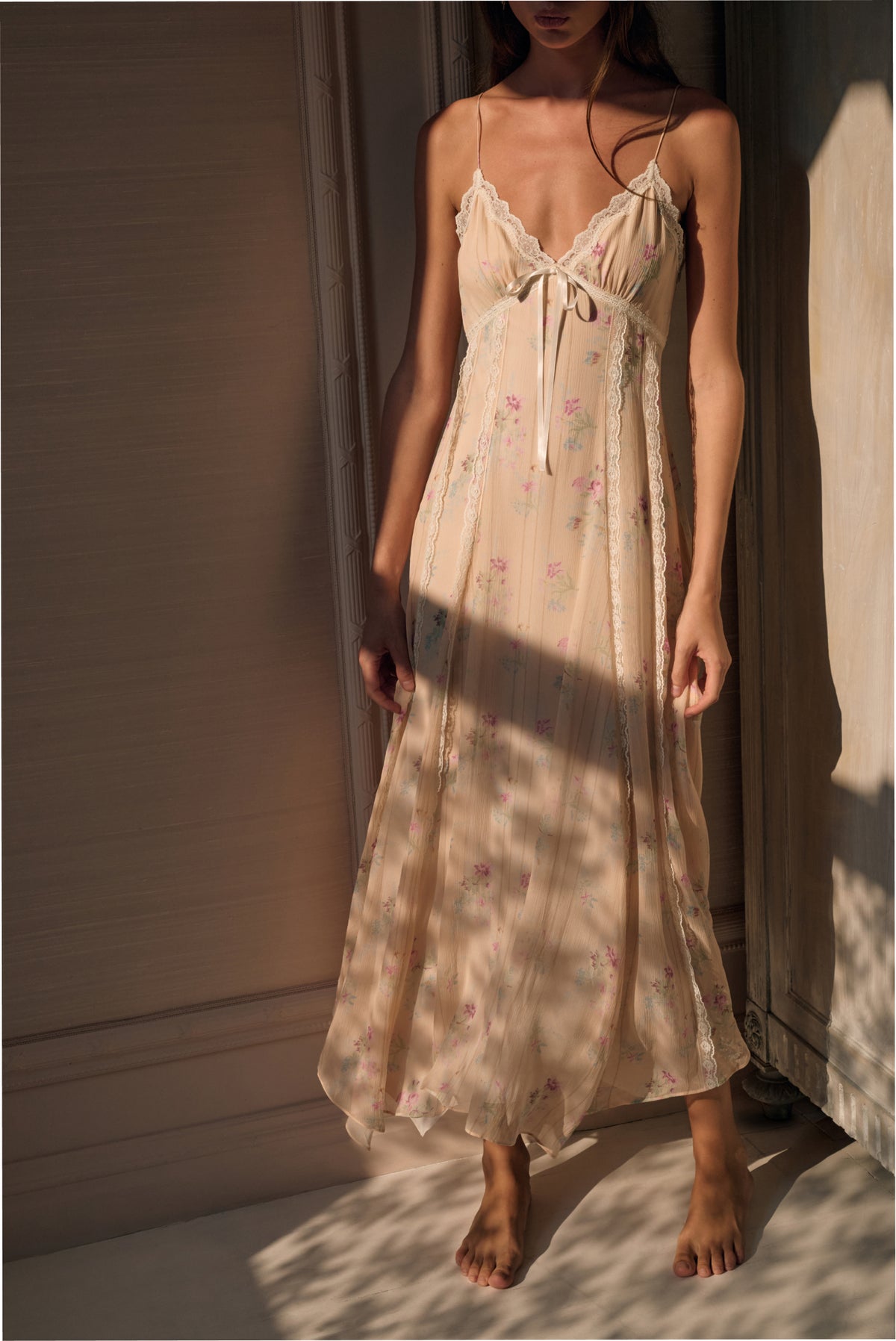 Floral print silk slip dress with lace-trimmed straps and bow detail, mid-calf length