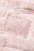 Close-up of throw blanket in petal pink textured with a soft, frosted finish