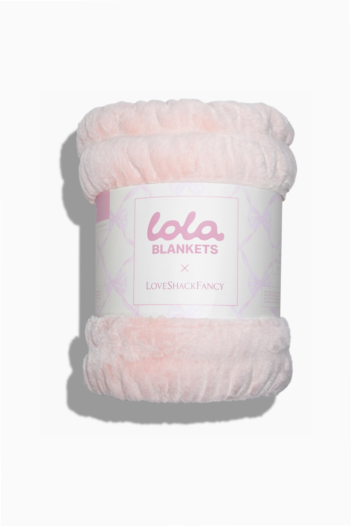 Petal pink plush blanket roll with LoveBlankets label and LoveShackFancy logo