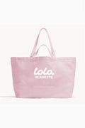 Pink tote bag with LoveShackFancy and Lola Blankets logo
