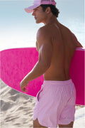 Mens pink printed swim shorts with elastic waistband and drawstring ties