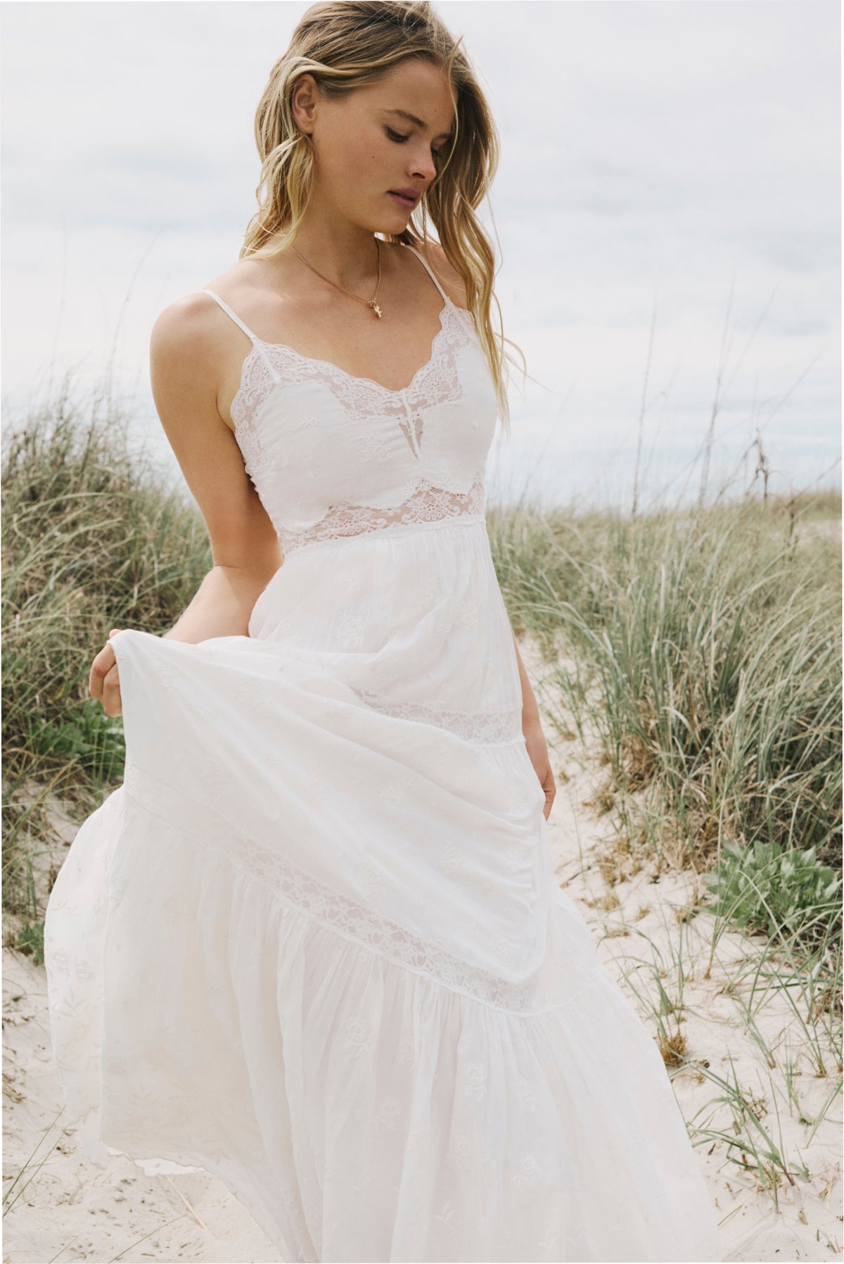 Optic white lace-trim maxi dress with spaghetti straps and flowing tiered skirt