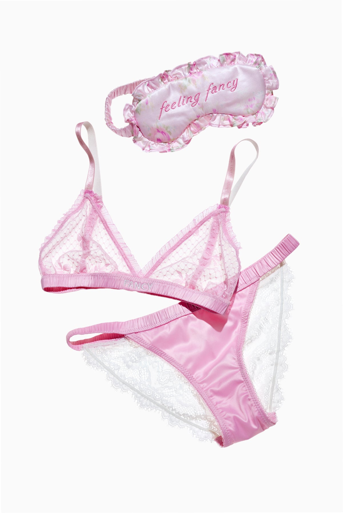 Pink lace panty with ruffled trim and lace sides, shown with matching lingerie