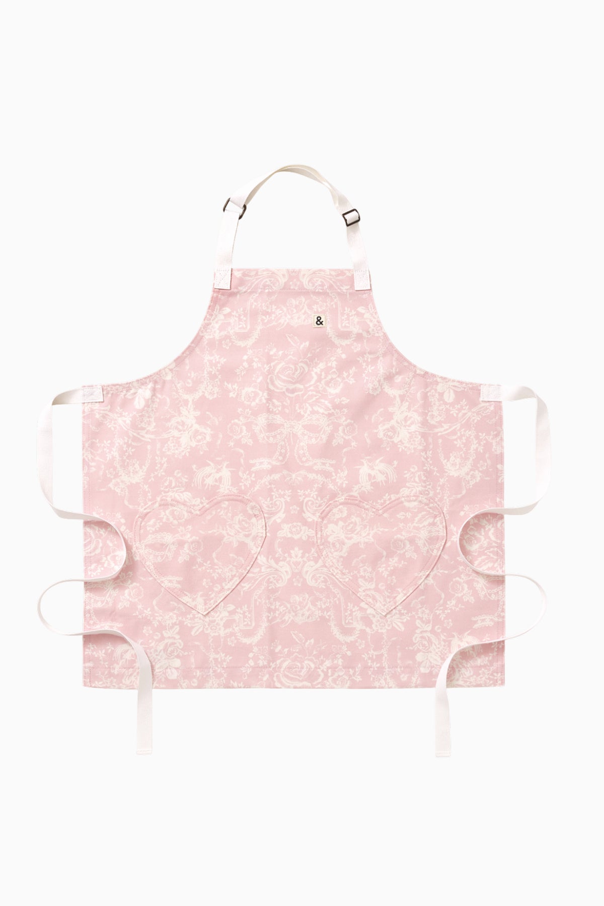 Kids pink printed apron with neck strap, front tie, and ruffled edges