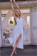 Floral maxi dress with lace-trimmed V-neck, spaghetti straps, side slit, standing pose